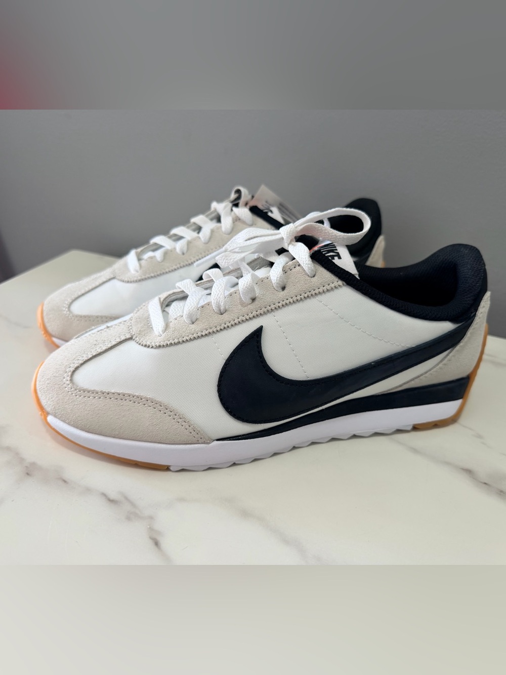 Nike women 8.5 Retro Runner Sneakers in White and Black